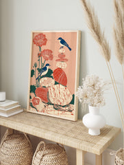 Illustrated bird and poppy wall art print with two blue birds, red flowers, and stacked stones on a peach background. - Image 3