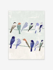 Illustrative bird wall art featuring a group of colorful songbirds perched on two wires against a pale green background