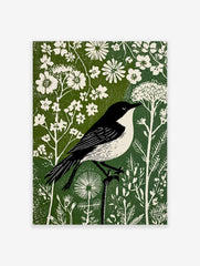 Black and white bird in linocut style perched on branch amidst white flowers and green foliage print