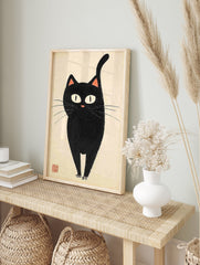 Minimalist black cat poster in Japanese illustrative style with large white eyes and pink nose on a cream background. - Image 4