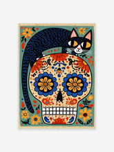 Illustrative Day of the Dead skull with a black cat on top and colourful floral patterns on a beige background