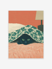 Illustrative print of a black cat with green eyes peeking from under a green palm leaf patterned blanket on a coral bed