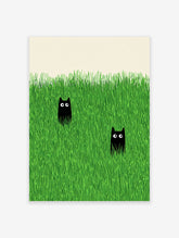 Two black cats with wide eyes peeking out from tall, vibrant green grass in a minimalist illustration style wall art.