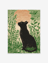 Black cat silhouette looking at a large orange moon in a field of green plants, illustrative print