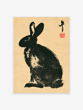 Black rabbit in Japanese ink style with tall ears and red seal stamp on tan background