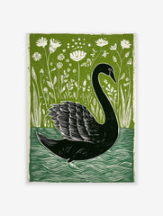 Black swan swimming among white wildflowers and green reeds in a linocut style art print