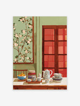 Still life painting of a teapot, tea cups, fruit bowl, and books on a table with blossom art
