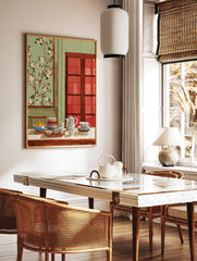 Still life painting of a teapot, tea cups, fruit bowl, and books on a table with blossom art, in a styled room mockup