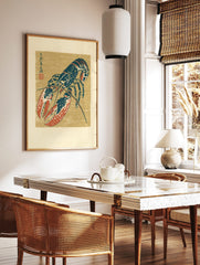 Japanese illustrative blue and red lobster print with kanji script on a tan background, in a styled room mockup