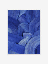 Blue abstract wall art featuring thick, textured brushstrokes forming curved and wavy patterns on a canvas.
