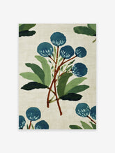 Blue botanical wall art print with painterly style blue flowers and green leaves on a light beige background.