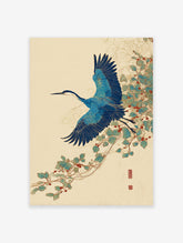 Japanese blue crane wall art print in flight with blue wings and long beak, flying past green leaves and red berries on a vine.