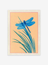 Blue dragonfly print on orange background with green reeds in a Japanese illustration style, framed by red line.