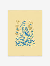 Illustrative blue heron standing amongst blue cattails and reeds with golden flourishes on a pale yellow background