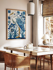 White heron with blue and gold feathers standing in water with blue flowers, in a tile-style art, in a styled room mockup