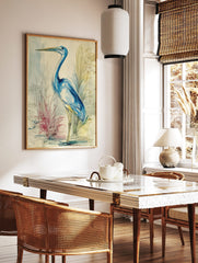 Blue heron watercolour illustration with blue washes, ink lines, and faint handwritten notes on a, in a styled room mockup