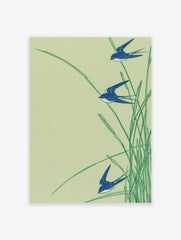Japanese-style art print featuring three blue swallows flying through green reeds on a light green background.