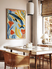 Blue whale swimming among stylized yellow and orange seaweed, modern illustrative ocean art print, in a styled room mockup