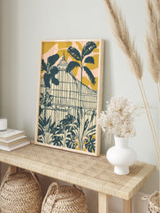 Illustrative botanical greenhouse with tropical plants in dark teal, cream, golden yellow, in an alternate framed mockup