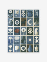 Grid artwork with cats, flowers, pottery, and celestial symbols in blue, white, and brown on a paper wall art print