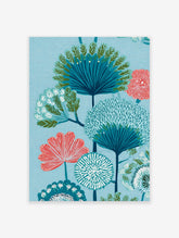 Stylized botanical tree poster with blue and coral flowers and foliage on a textured light blue background.