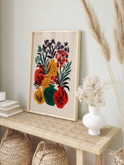 Vibrant botanical vase poster featuring a modern illustration of red, yellow, and green vases with black and red flowers. - Image 4