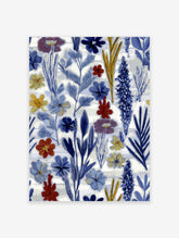 Abstract botanical wall art print with blue, red, and yellow flowers and leaves on a white background