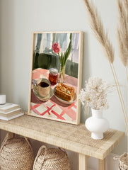 Watercolour illustration of a pink tulip, coffee, and buttered toast on a red and white, in an alternate framed mockup