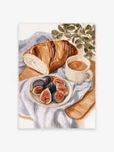 Watercolor breakfast illustration with bread, sliced figs, coffee, and eucalyptus on a blue cloth background