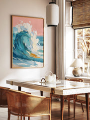 Textured impasto painting of a large breaking ocean wave with blue water, white foam, and a pink sky, in a styled room mockup