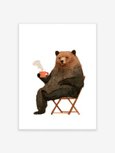 Watercolour illustration of a brown bear sitting in a chair and holding a steaming red mug on a white background