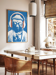 Illustrative print of a Buddha statue wearing headphones in blue and white on a textured background, in a styled room mockup