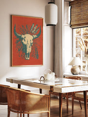 Bull skull poster with feathers on a reddish-orange background, featuring teal horns and beige skull details. - Image 2