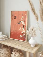 Japanese poster with two orange and black butterflies flying around white plum blossoms on a reddish-orange background. - Image 4