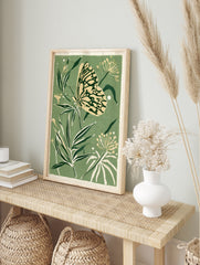 Butterfly and botanical foliage illustration in sage green and cream colours as a botanical, in an alternate framed mockup