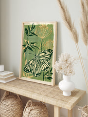 Botanical art print featuring a detailed butterfly with striped wings on a sage green, in an alternate framed mockup
