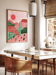 Illustrated cactus desert landscape wall art with pink and red mountains, green cactuses, and a bright sun. - Image 2