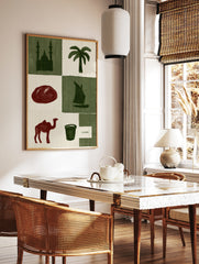 Cairo travel poster art featuring icons like a mosque, palm tree, sailboat, and camel in a green, in a styled room mockup