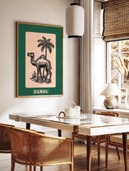 Black line art illustration of a camel and palm tree on beige, with a dark green border. CAMEL text, in a styled room mockup