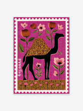 Stylized black camel with floral hump and pink flowers on a magenta background, designed as a perforated stamp print.