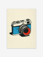 Illustrated vintage camera art print with a blue body and red lens on a cream background, showcasing a retro style.