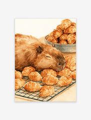 Watercolour illustration of a sleeping capybara resting on a wire rack filled with golden croissants