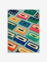 Colorful cassette tapes wall art print on a light blue background, featuring various retro audio cassettes.