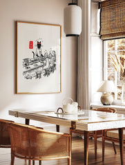 Illustrative print of a black cat sushi chef in uniform serving customers at a counter with, in a styled room mockup