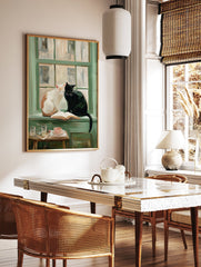 Painterly art print showing a white and a black cat sitting on a green windowsill with an open book, teacup, and glasses. - Image 2