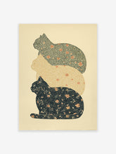 Three stacked patterned cats in dark green, beige, and dark blue with orange floral designs, presented as vintage style cat wall art.