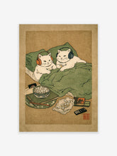 Japanese-style cat wall art showing two white cats with headphones in bed, surrounded by popcorn and a remote.