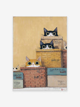 Whimsical Cat Wall Art featuring several black and white and ginger cats peeking from stacked boxes against a yellow background.