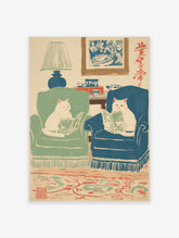 Illustrated art print featuring two white cats in armchairs reading books in a cozy living room with a lamp and rug.