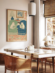 Illustrated art print featuring two white cats in armchairs reading books in a cozy living room with a lamp and rug. - Image 2